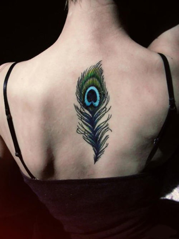 Girl-with-peacock-feather-tattoo-on-her-back