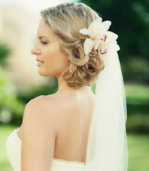Beach Wedding Hairstyle With Flowers And Veil